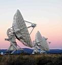 VLA dishes against colorful sky